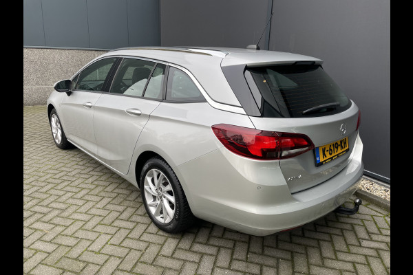 Opel Astra Sports Tourer 1.2 Business Elegance Airco - Cruise control - Parkeersensoren voor en achter - Achteruitrijcamera - Navigatie - Bluetooth - Keyless start and entry - Start/stop systeem - Stuur leder - Stuur multifunctioneel