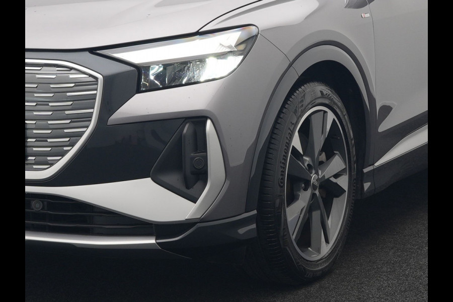 Audi Q4 e-tron 50 quattro S Line 77 kWh 299pk Dealer O.H. INCL BTW | Panodak | Lederen Sportstoelen Verwarmd | Keyless | Navigatie | Cruise Control | Virtual | DAB | Taifungrau Metallic |