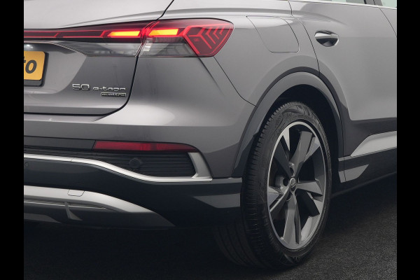 Audi Q4 e-tron 50 quattro S Line 77 kWh 299pk Dealer O.H. INCL BTW | Panodak | Lederen Sportstoelen Verwarmd | Keyless | Navigatie | Cruise Control | Virtual | DAB | Taifungrau Metallic |