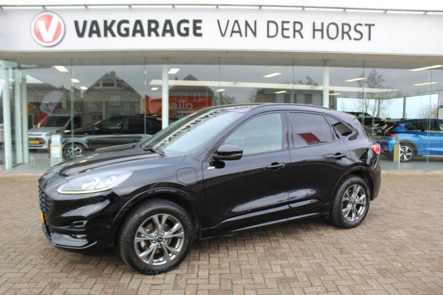 Ford Kuga 2.5-225pk Plug-in Hybrid ST-Line X. Hybride rijden voor een reële prijs ! Adaptive Cruise Control, Stoel- en voorraamverwarming, Climate Control, Metallic lak, Camera v+a, Elektr. achterklep, Side- en lane assist etc.