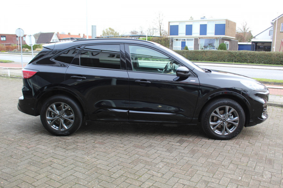 Ford Kuga 2.5-225pk Plug-in Hybrid ST-Line X. Hybride rijden voor een reële prijs ! Adaptive Cruise Control, Stoel- en voorraamverwarming, Climate Control, Metallic lak, Camera v+a, Elektr. achterklep, Side- en lane assist etc.
