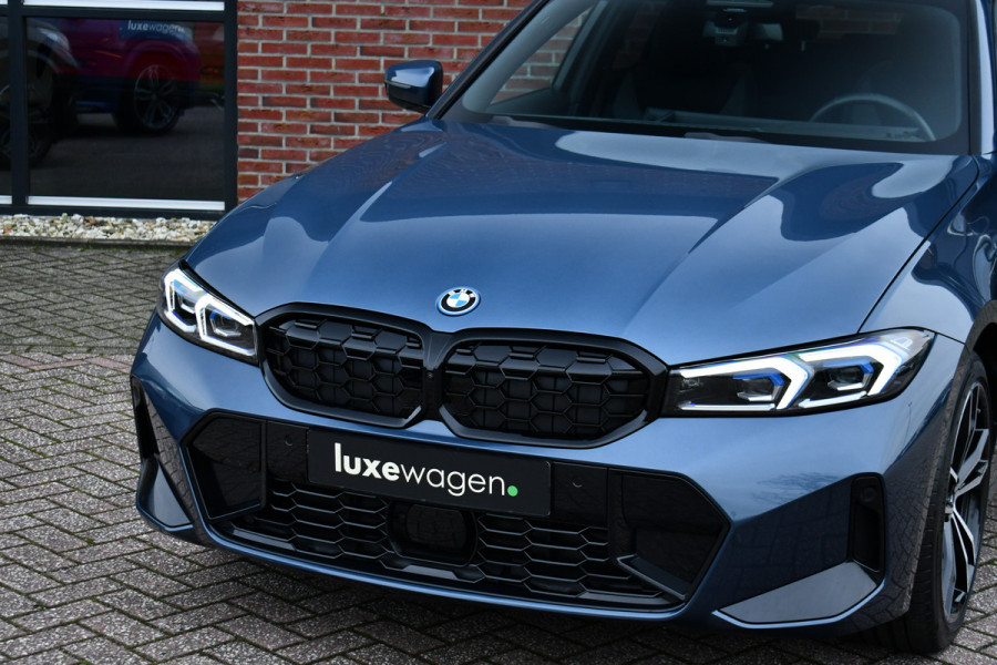 BMW 3 Serie Touring 330e M-Sport LCI-2 Pano Trekh ACC H/K 360 HUD 19inch