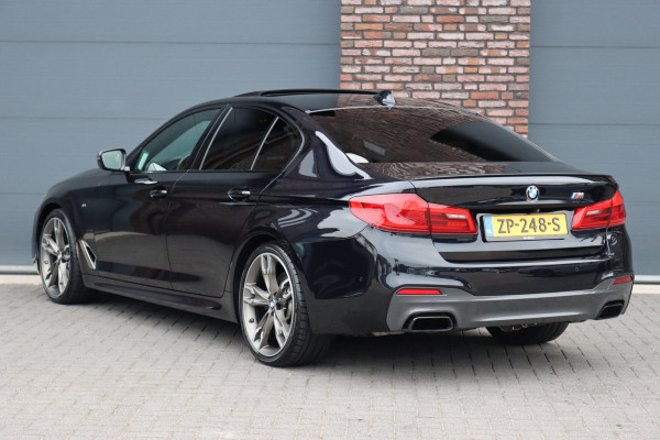 BMW 5 Serie M550d xDrive High Executive | Schuifdak | Bowers&Wilkins | ACC | Trekhaak | Entertainment Achter | Parfumering | Stoelventilatie | HUD | Massage | Standverwarming | Zonnerollo's | Display Key | Aerodynamicapakket |
