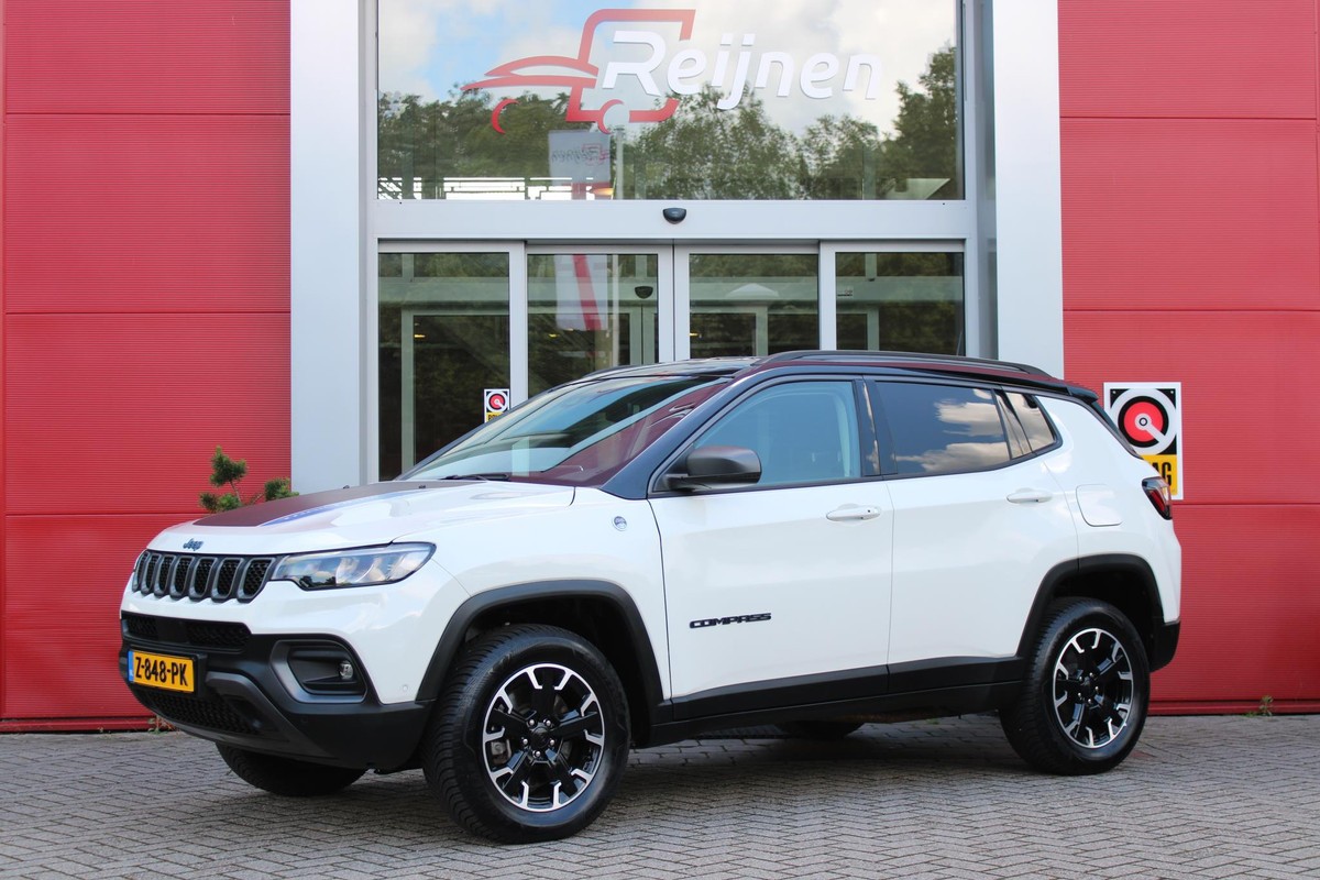 Jeep Compass 4xe 240PK PHEV TRAILHAWK AUTOMAAT | NAVIGATIE | ACHTERUIRIJ  CAMERA | DRAADLOOS APPLE CARPLAY / ANDROID AUTO | DIGITALE COCKPIT | LED KOPLAMPEN / ACHTERLICHTEN | LED MIST LAMPEN | 17" OFF-ROAD LICHTMETALEN VELGEN | ALL SEASON BANDEN | DRAADLOOS LADEN | ADAPTIVE CRUISE / CRUISE CONTROL | TREKHAAK | 4 WIELAANDRIJVING | PARKEERSENSOREN VOOR / ACHTER |