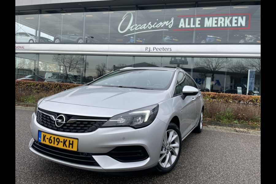 Opel Astra Sports Tourer 1.2 Business Elegance Airco - Cruise control - Parkeersensoren voor en achter - Achteruitrijcamera - Navigatie - Bluetooth - Keyless start and entry - Start/stop systeem - Stuur leder - Stuur multifunctioneel