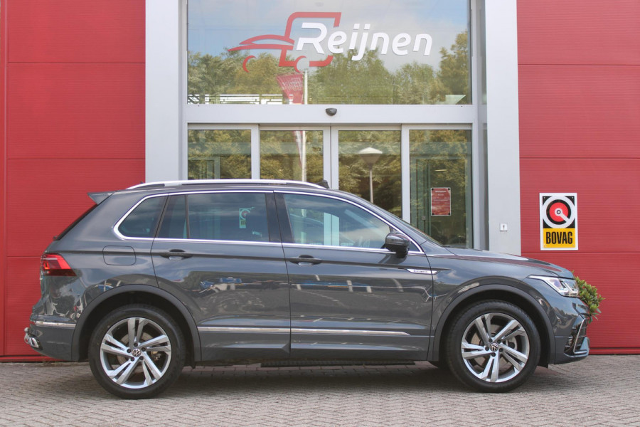 Volkswagen Tiguan 1.4 TSI 245PK eHybrid R-LINE BUSINESS + | BEKLEDING LEDER VIENNA | PANORAMISCH SCHUIF/KANTEL DAK | ELEKTRISCH WEGKLAPENBARE TREKHAAK | R-LINE INTERIEUR/EXTERIEUR | VERWARMBARE VOORSTOELEN/STUUR | ELEKTRISCH BEDIENBARE VOORSTOELEN MET GEHEUGEN FUNCTIE | AKOESTISCH GLAS GETINT | KEYLESS ACCESS/START | ELEKTRISCH BEDIENABRE ACHTERKLEP | DAKSPOILER R-LINE | SFEER VERLICHTING | RIJASSISTENT PAKKET O.A. LANE ASSIST EN ADAPTIVE CRUISE CONTROL EN DODEHOEK DETECTIE | NAVIGATIE | APPLE CARPLAY/ANDROID AUTO | DAB+ RADIO | LED MATRIX KOPLAMPEN (IQ LIGHT) | DRAADLOZE TELEFOONLADER