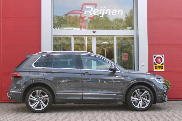 Volkswagen Tiguan 1.4 TSI 245PK eHybrid R-LINE BUSINESS + | BEKLEDING LEDER VIENNA | PANORAMISCH SCHUIF/KANTEL DAK | ELEKTRISCH WEGKLAPENBARE TREKHAAK | R-LINE INTERIEUR/EXTERIEUR | VERWARMBARE VOORSTOELEN/STUUR | ELEKTRISCH BEDIENBARE VOORSTOELEN MET GEHEUGEN FUNCTIE | AKOESTISCH GLAS GETINT | KEYLESS ACCESS/START | ELEKTRISCH BEDIENABRE ACHTERKLEP | DAKSPOILER R-LINE | SFEER VERLICHTING | RIJASSISTENT PAKKET O.A. LANE ASSIST EN ADAPTIVE CRUISE CONTROL EN DODEHOEK DETECTIE | NAVIGATIE | APPLE CARPLAY/ANDROID AUTO | DAB+ RADIO | LED MATRIX KOPLAMPEN (IQ LIGHT) | DRAADLOZE TELEFOONLADER
