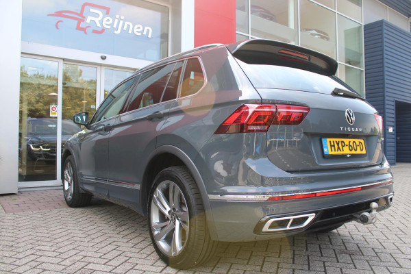 Volkswagen Tiguan 1.4 TSI 245PK eHybrid R-LINE BUSINESS + | BEKLEDING LEDER VIENNA | PANORAMISCH SCHUIF/KANTEL DAK | ELEKTRISCH WEGKLAPENBARE TREKHAAK | R-LINE INTERIEUR/EXTERIEUR | VERWARMBARE VOORSTOELEN/STUUR | ELEKTRISCH BEDIENBARE VOORSTOELEN MET GEHEUGEN FUNCTIE | AKOESTISCH GLAS GETINT | KEYLESS ACCESS/START | ELEKTRISCH BEDIENABRE ACHTERKLEP | DAKSPOILER R-LINE | SFEER VERLICHTING | RIJASSISTENT PAKKET O.A. LANE ASSIST EN ADAPTIVE CRUISE CONTROL EN DODEHOEK DETECTIE | NAVIGATIE | APPLE CARPLAY/ANDROID AUTO | DAB+ RADIO | LED MATRIX KOPLAMPEN (IQ LIGHT) | DRAADLOZE TELEFOONLADER