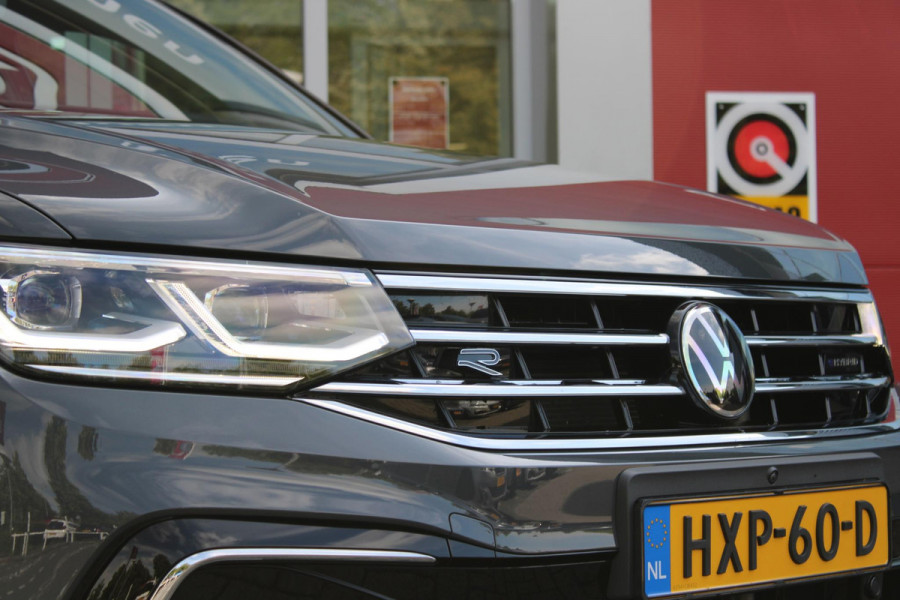 Volkswagen Tiguan 1.4 TSI 245PK eHybrid R-LINE BUSINESS + | BEKLEDING LEDER VIENNA | PANORAMISCH SCHUIF/KANTEL DAK | ELEKTRISCH WEGKLAPENBARE TREKHAAK | R-LINE INTERIEUR/EXTERIEUR | VERWARMBARE VOORSTOELEN/STUUR | ELEKTRISCH BEDIENBARE VOORSTOELEN MET GEHEUGEN FUNCTIE | AKOESTISCH GLAS GETINT | KEYLESS ACCESS/START | ELEKTRISCH BEDIENABRE ACHTERKLEP | DAKSPOILER R-LINE | SFEER VERLICHTING | RIJASSISTENT PAKKET O.A. LANE ASSIST EN ADAPTIVE CRUISE CONTROL EN DODEHOEK DETECTIE | NAVIGATIE | APPLE CARPLAY/ANDROID AUTO | DAB+ RADIO | LED MATRIX KOPLAMPEN (IQ LIGHT) | DRAADLOZE TELEFOONLADER