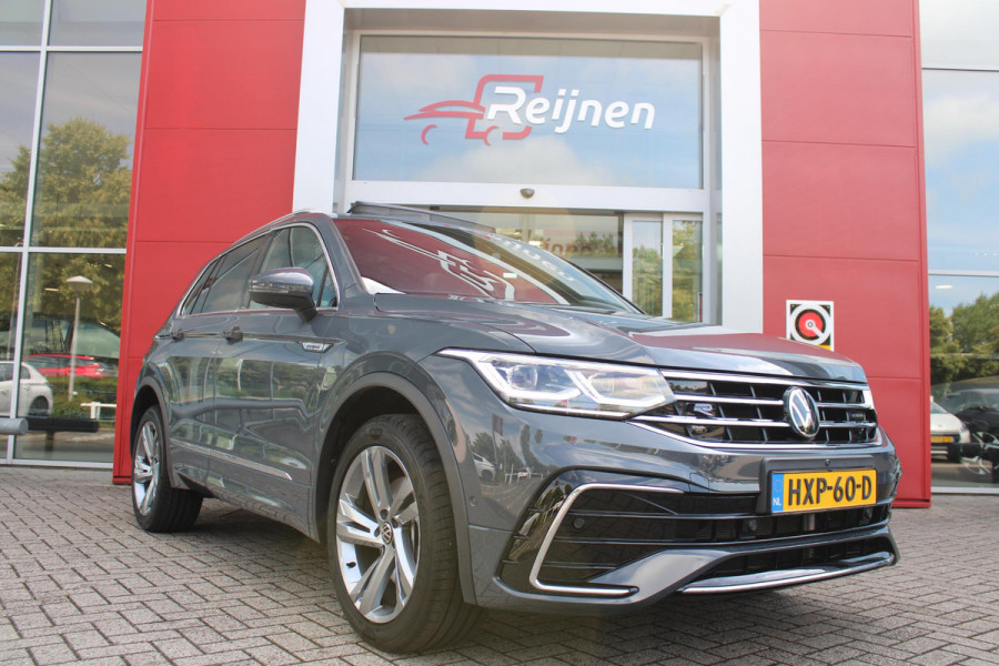 Volkswagen Tiguan 1.4 TSI 245PK eHybrid R-LINE BUSINESS + | BEKLEDING LEDER VIENNA | PANORAMISCH SCHUIF/KANTEL DAK | ELEKTRISCH WEGKLAPENBARE TREKHAAK | R-LINE INTERIEUR/EXTERIEUR | VERWARMBARE VOORSTOELEN/STUUR | ELEKTRISCH BEDIENBARE VOORSTOELEN MET GEHEUGEN FUNCTIE | AKOESTISCH GLAS GETINT | KEYLESS ACCESS/START | ELEKTRISCH BEDIENABRE ACHTERKLEP | DAKSPOILER R-LINE | SFEER VERLICHTING | RIJASSISTENT PAKKET O.A. LANE ASSIST EN ADAPTIVE CRUISE CONTROL EN DODEHOEK DETECTIE | NAVIGATIE | APPLE CARPLAY/ANDROID AUTO | DAB+ RADIO | LED MATRIX KOPLAMPEN (IQ LIGHT) | DRAADLOZE TELEFOONLADER