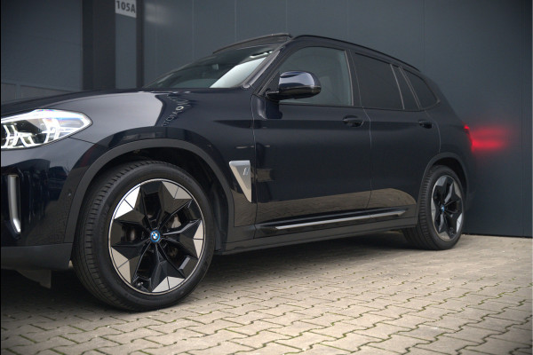 BMW iX3 High Executive 80 kWh | Panoramadak | Keyless | Stoelverwarming | Harman Kardon | Memory Seat | Head-Up Display | 360 Camera | Ambiance Verlichting | Trekhaak | Adaptive LED | Elektrische Stoelen | Apple Carplay |