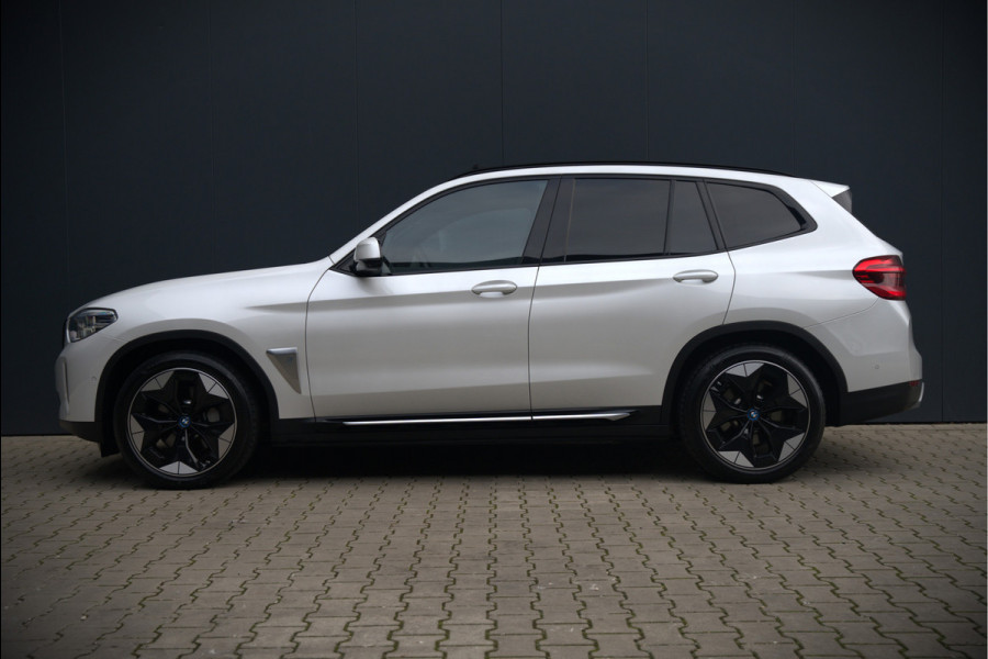 BMW iX3 High Executive 80 kWh | Panoramadak | Keyless | Stoelverwarming | Harman Kardon | Memory Seat | Head-Up Display | 360 Camera | Adaptief Onderstel | Trekhaak | Adaptive LED | Elektrische Stoelen | Apple Carplay | N