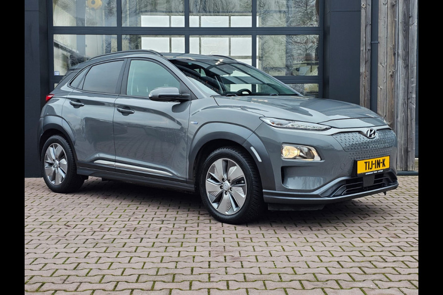 Hyundai Kona EV Comfort 39 kWh | SOH 98% | Stoelverwarming | Krell | Navi |  All-seasons | Camera | Stuurverwarming | Rijklaar |