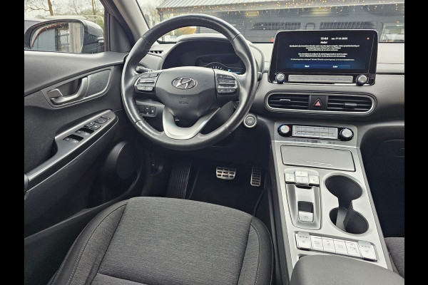 Hyundai Kona EV Comfort 39 kWh | SOH 98% | Stoelverwarming | Krell | Navi |  All-seasons | Camera | Stuurverwarming | Rijklaar |