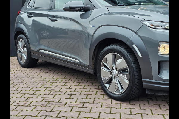 Hyundai Kona EV Comfort 39 kWh | SOH 98% | Stoelverwarming | Krell | Navi |  All-seasons | Camera | Stuurverwarming | Rijklaar |