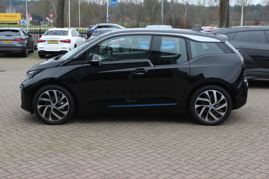 BMW i3 Basis 120Ah 42 kWh / SoH 91.4% / Navigatie / 19'' / Parkeerhulp achter / Navigatie / Harman Kardon / Stoelverwarming / Cruise Control / Warmtepomp / Getint glas