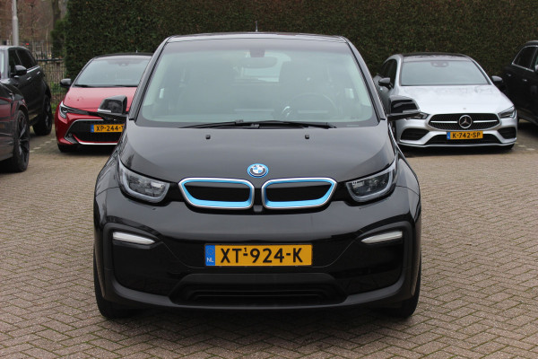 BMW i3 Basis 120Ah 42 kWh / SoH 91.4% / Navigatie / 19'' / Parkeerhulp achter / Navigatie / Harman Kardon / Stoelverwarming / Cruise Control / Warmtepomp / Getint glas