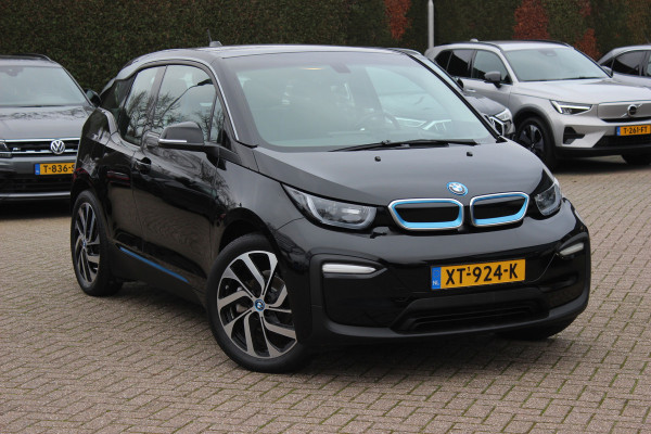 BMW i3 Basis 120Ah 42 kWh / SoH 91.4% / Navigatie / 19'' / Parkeerhulp achter / Navigatie / Harman Kardon / Stoelverwarming / Cruise Control / Warmtepomp / Getint glas