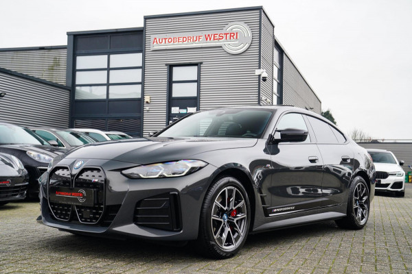 BMW i4 M50 High Executive 84 kWh | BTW | 360 Camera | LASER | Dravitgrau metallic | Adaptieve Cruise | Trekhaak | Schuif/kanteldak