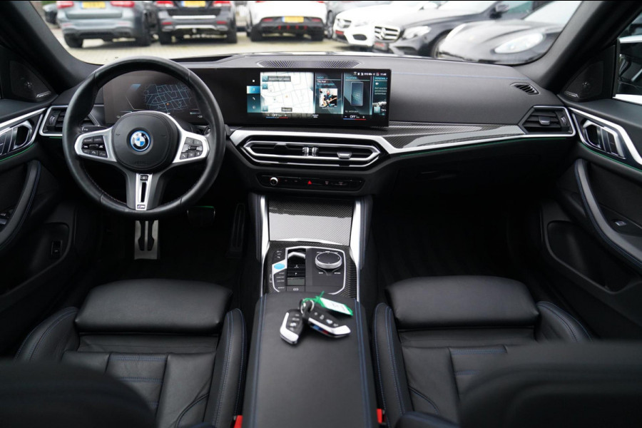 BMW i4 M50 High Executive 84 kWh | BTW | 360 Camera | LASER | Dravitgrau metallic | Adaptieve Cruise | Trekhaak | Schuif/kanteldak