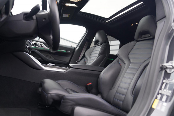 BMW i4 M50 High Executive 84 kWh | BTW | 360 Camera | LASER | Dravitgrau metallic | Adaptieve Cruise | Trekhaak | Schuif/kanteldak