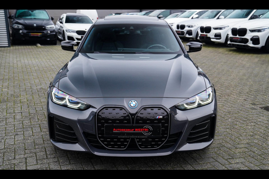 BMW i4 M50 High Executive 84 kWh | BTW | 360 Camera | LASER | Dravitgrau metallic | Adaptieve Cruise | Trekhaak | Schuif/kanteldak