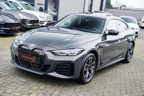 BMW i4 M50 High Executive 84 kWh | BTW | 360 Camera | LASER | Dravitgrau metallic | Adaptieve Cruise | Trekhaak | Schuif/kanteldak