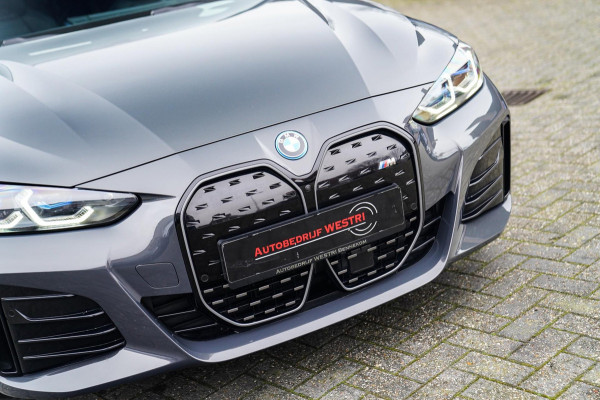 BMW i4 M50 High Executive 84 kWh | BTW | 360 Camera | LASER | Dravitgrau metallic | Adaptieve Cruise | Trekhaak | Schuif/kanteldak