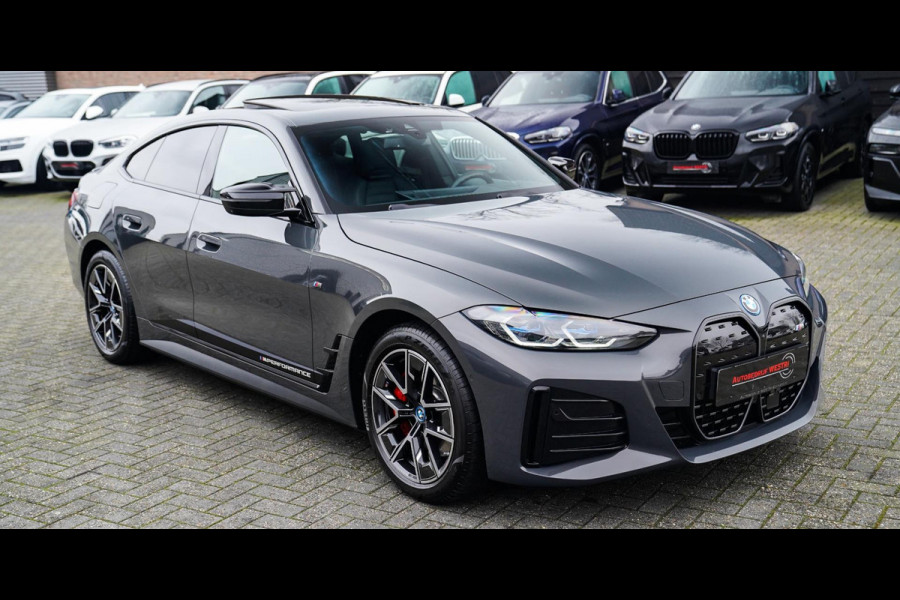 BMW i4 M50 High Executive 84 kWh | BTW | 360 Camera | LASER | Dravitgrau metallic | Adaptieve Cruise | Trekhaak | Schuif/kanteldak