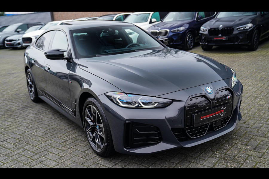 BMW i4 M50 High Executive 84 kWh | BTW | 360 Camera | LASER | Dravitgrau metallic | Adaptieve Cruise | Trekhaak | Schuif/kanteldak