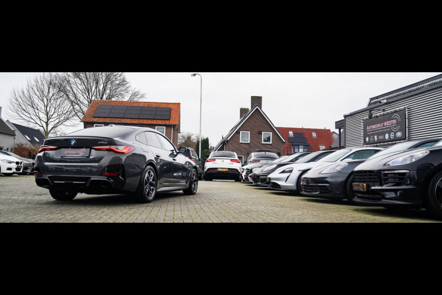 BMW i4 M50 High Executive 84 kWh | BTW | 360 Camera | LASER | Dravitgrau metallic | Adaptieve Cruise | Trekhaak | Schuif/kanteldak