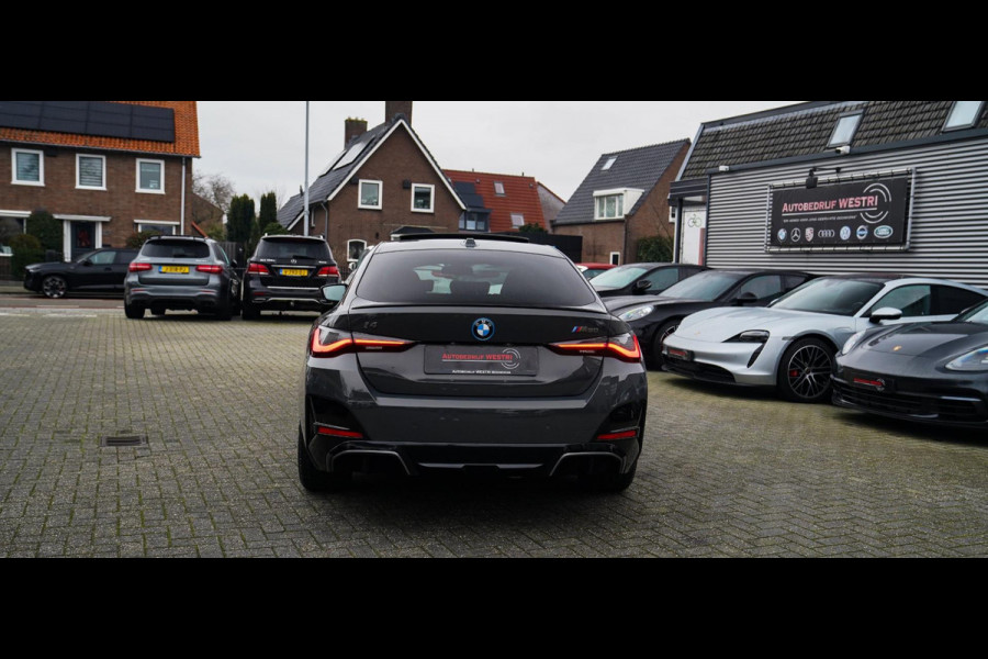 BMW i4 M50 High Executive 84 kWh | BTW | 360 Camera | LASER | Dravitgrau metallic | Adaptieve Cruise | Trekhaak | Schuif/kanteldak