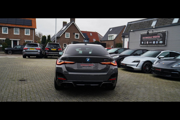 BMW i4 M50 High Executive 84 kWh | BTW | 360 Camera | LASER | Dravitgrau metallic | Adaptieve Cruise | Trekhaak | Schuif/kanteldak