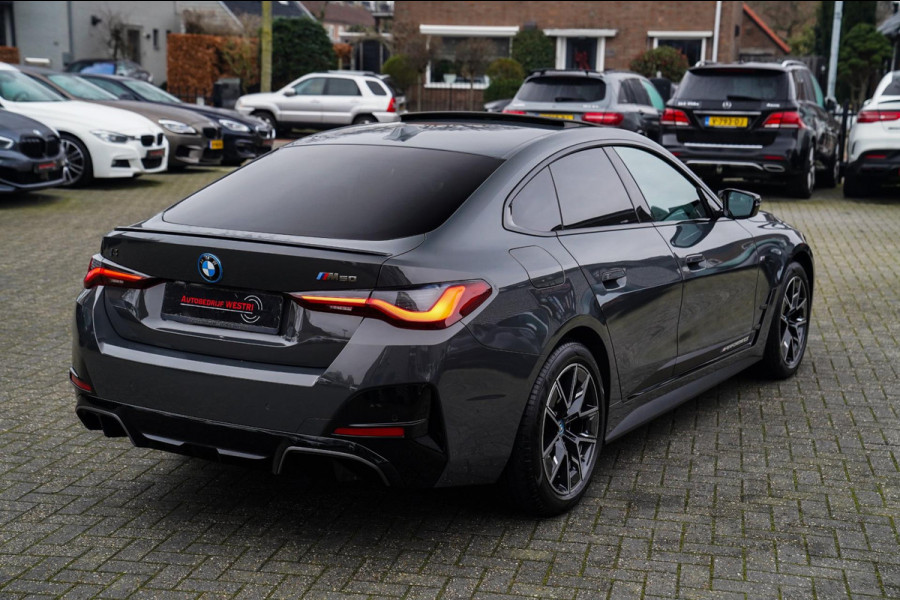 BMW i4 M50 High Executive 84 kWh | BTW | 360 Camera | LASER | Dravitgrau metallic | Adaptieve Cruise | Trekhaak | Schuif/kanteldak