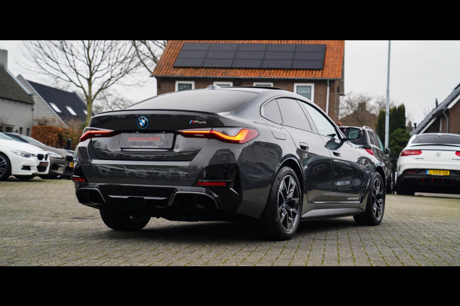 BMW i4 M50 High Executive 84 kWh | BTW | 360 Camera | LASER | Dravitgrau metallic | Adaptieve Cruise | Trekhaak | Schuif/kanteldak