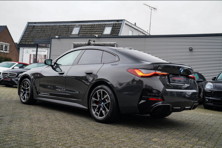 BMW i4 M50 High Executive 84 kWh | BTW | 360 Camera | LASER | Dravitgrau metallic | Adaptieve Cruise | Trekhaak | Schuif/kanteldak