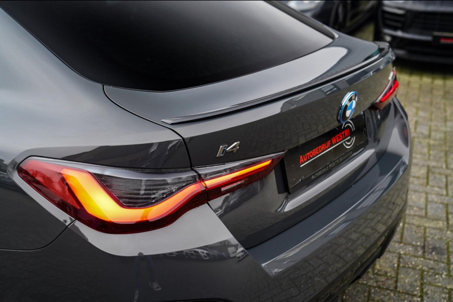 BMW i4 M50 High Executive 84 kWh | BTW | 360 Camera | LASER | Dravitgrau metallic | Adaptieve Cruise | Trekhaak | Schuif/kanteldak