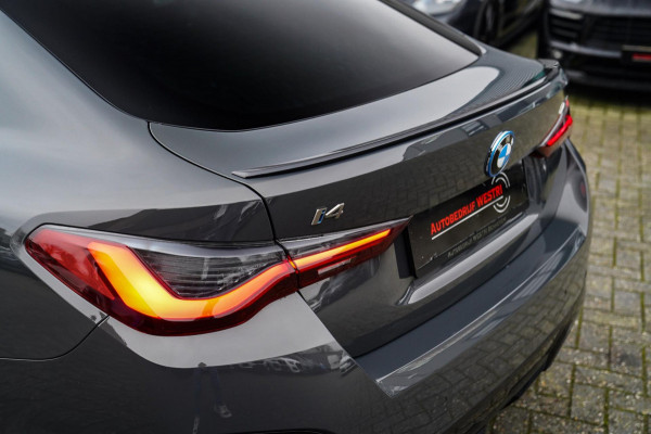 BMW i4 M50 High Executive 84 kWh | BTW | 360 Camera | LASER | Dravitgrau metallic | Adaptieve Cruise | Trekhaak | Schuif/kanteldak