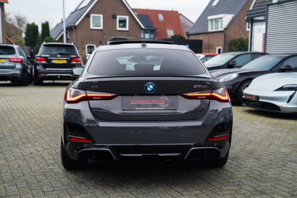 BMW i4 M50 High Executive 84 kWh | BTW | 360 Camera | LASER | Dravitgrau metallic | Adaptieve Cruise | Trekhaak | Schuif/kanteldak