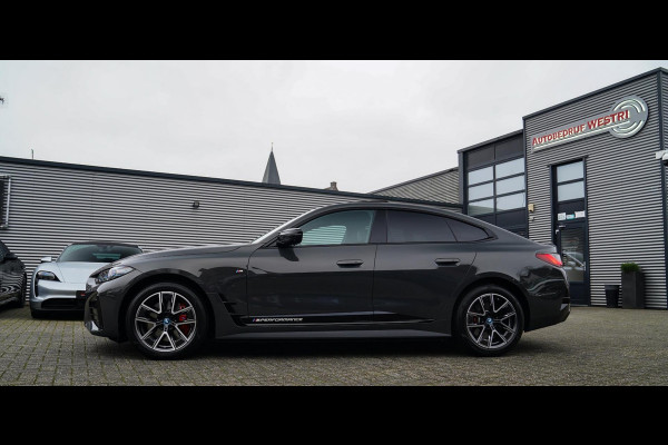 BMW i4 M50 High Executive 84 kWh | BTW | 360 Camera | LASER | Dravitgrau metallic | Adaptieve Cruise | Trekhaak | Schuif/kanteldak