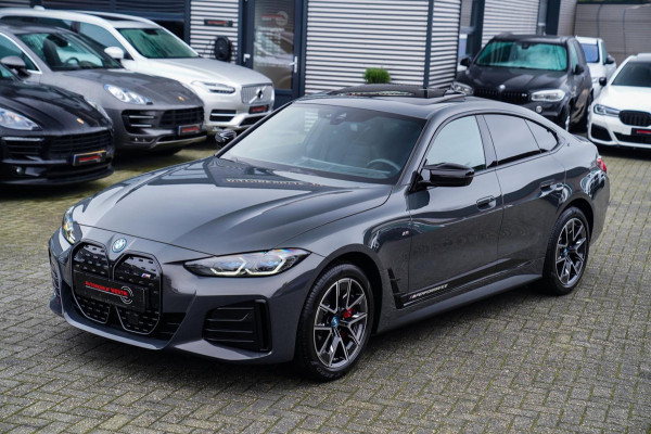 BMW i4 M50 High Executive 84 kWh | BTW | 360 Camera | LASER | Dravitgrau metallic | Adaptieve Cruise | Trekhaak | Schuif/kanteldak