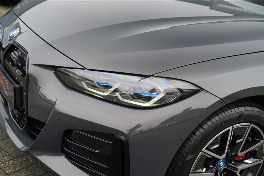 BMW i4 M50 High Executive 84 kWh | BTW | 360 Camera | LASER | Dravitgrau metallic | Adaptieve Cruise | Trekhaak | Schuif/kanteldak