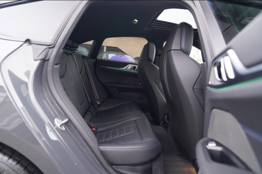 BMW i4 M50 High Executive 84 kWh | BTW | 360 Camera | LASER | Dravitgrau metallic | Adaptieve Cruise | Trekhaak | Schuif/kanteldak