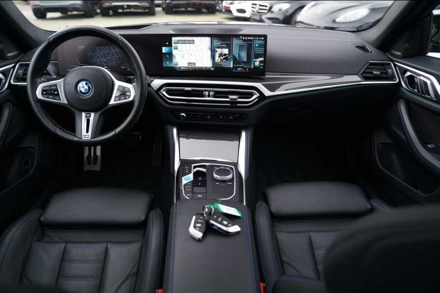 BMW i4 M50 High Executive 84 kWh | BTW | 360 Camera | LASER | Dravitgrau metallic | Adaptieve Cruise | Trekhaak | Schuif/kanteldak