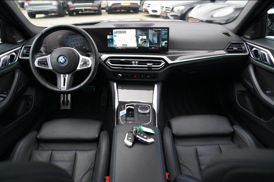 BMW i4 M50 High Executive 84 kWh | BTW | 360 Camera | LASER | Dravitgrau metallic | Adaptieve Cruise | Trekhaak | Schuif/kanteldak