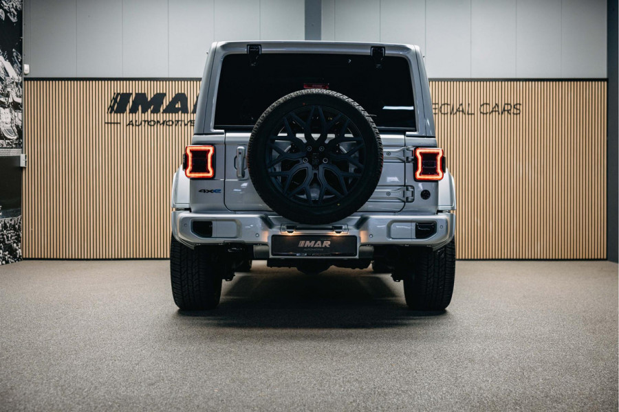 Jeep Wrangler Unlimited 4xe 380 Sahara | Corse Edition Custom Made | Hybride | Stuur- en Stoelverwarming | Achteruitrijcamera |
