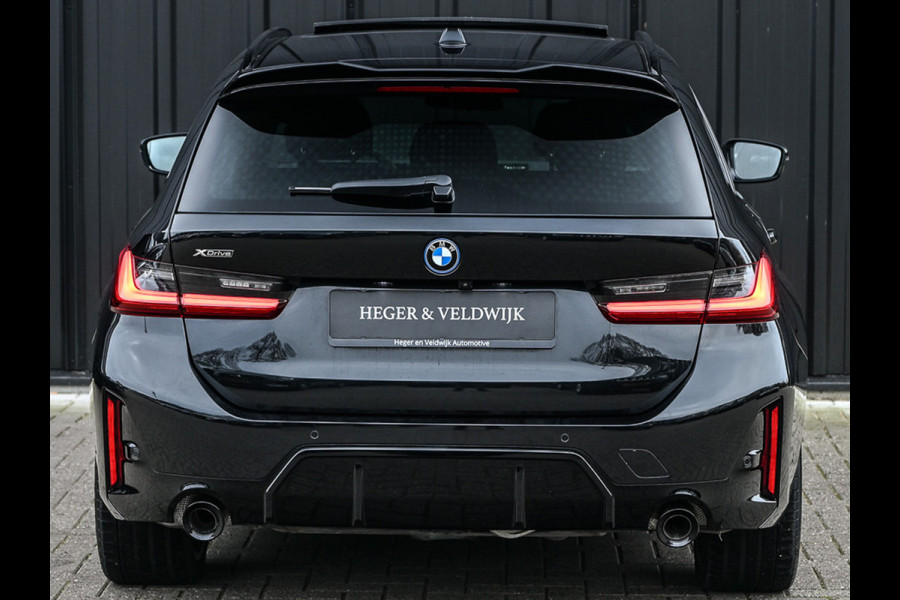 BMW 3 Serie Touring 330e xDrive · M sport · Accu 19,5kWh · Trekhaak · Panoramadak · Active Cruise · Camera · Ambiance interieur ·