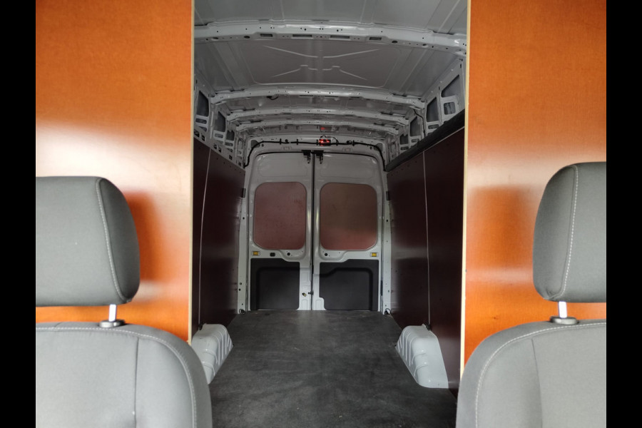 Ford Transit 2.0TDCI 130pk 350 L4H3 Navi Camera Pdc Apple Carplay Android WiFi Airco Cruise Control Voorruit-Verwarmd Regensensor DAB Schuifdeur Betonplex Vloer Wandbetimmering Roll Stability Control Led Spoorwisselassist Euro 6 Zeer Compleet!