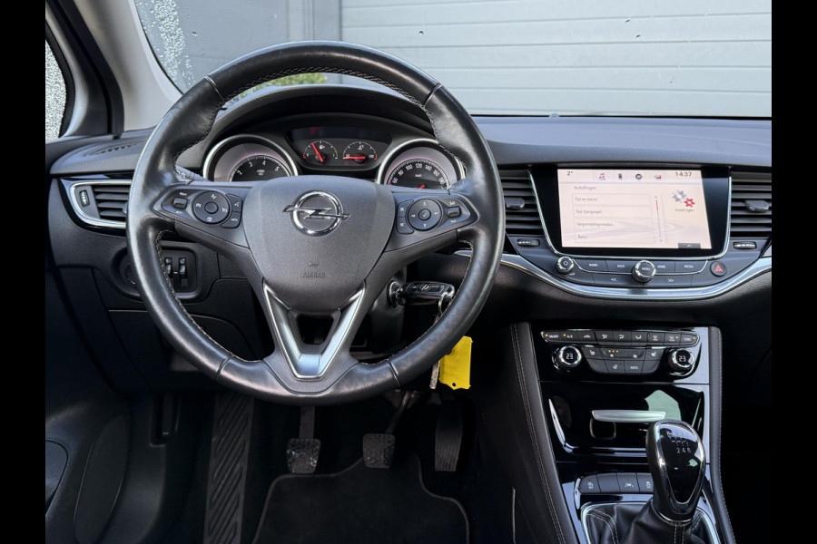 Opel Astra Sports Tourer 1.4 Innovation Navi,Camera,150pk,Rijstrooksensor,Stoelverw.Stuurverw.Clima,Cruise,Halfleder,Lm velgen,Pdc,V+A,Lm velgen,6 Bak,Apk tot 10-2026
