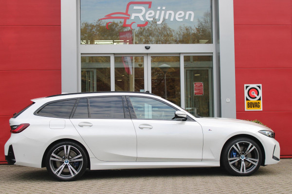 BMW 3 Serie Touring 330e 292PK M-SPORT | PANORAMISCH SCHUIF/KANTEL DAK | M-SPORT PRO-PAKKET | M-SPORT REMMEN UITGEVOERD IN DONKERBLAUW MET M LOGO | BMW LIVE COCKPIT PROFESSIONAL | CURVED DISPLAY |DRIVING ASSISTANT INCL. HEAD-UP DISPLAY | PARKING ASSIST INCL. ACHTERUITRIJCAMERA | ADAPTIEVE LED KOPLAMPEN |SHADOW LINE | M-SPORTSTOELEN VOOR | LEDER VERNASCA MET CONTRAST STIKSELS M-SPORT | STOEL VERWARMING | DRAADLOZE APPLE CARPLAY | ELEKTRISCH VERSTELBARE STOELEN MET GEHEUGEN FUNCTIE | HEAD UP DISPLAY | DRAADLOZE TELEFOONLADER | DODEHOEK BEWAKING | COMFORT PACK INCL. ELEKTRISCHE ACHTE